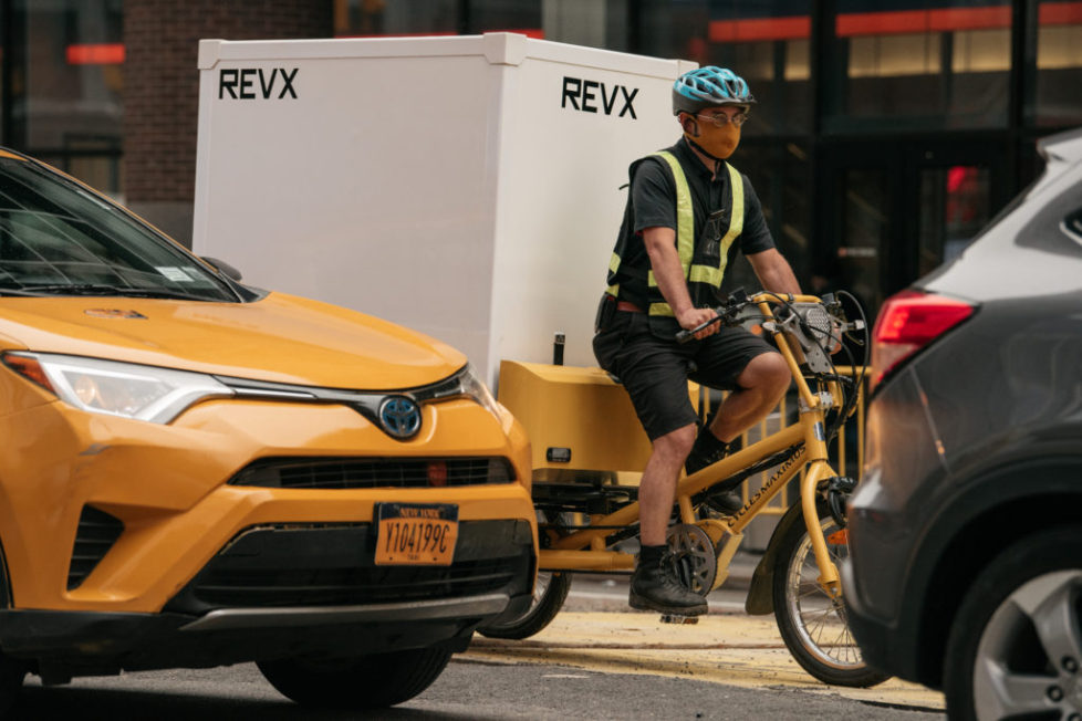 A Revolution X deliverist pilots the Cool Box through Midtown Manhattan traffic.